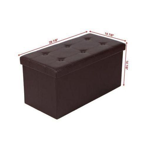 Pouf banc de rangement pliable en tissu marron foncé Calipto de dimensions 76x38x38 cm posé sur un tapis.