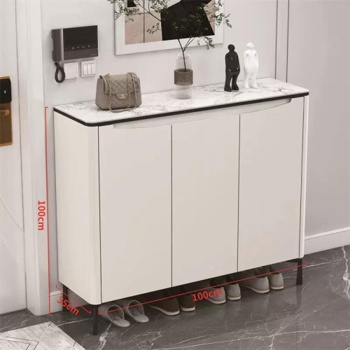 Meuble a chaussures blanc moderne trois portes avec plateau en verre et plantes decoratives