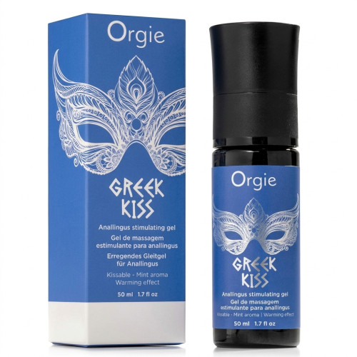 Flacon pompe noir et bleu Orgie Greek Kiss à côté de sa boîte d'emballage bleue arborant un masque de bal masqué sur fond blanc